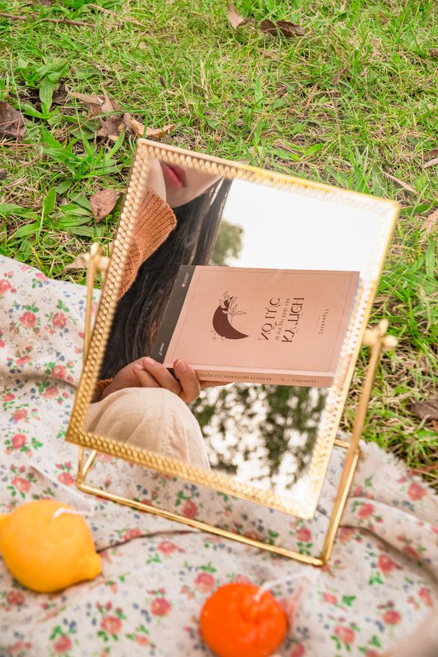 Open book with a warm, reflective setting symbolizing self-discovery and finding your way back to yourself.